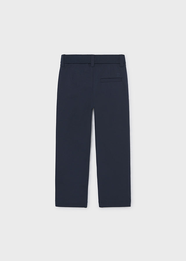 Темно-сині штани Mayoral для хлопчика ззаду з прямими довгими штанинами